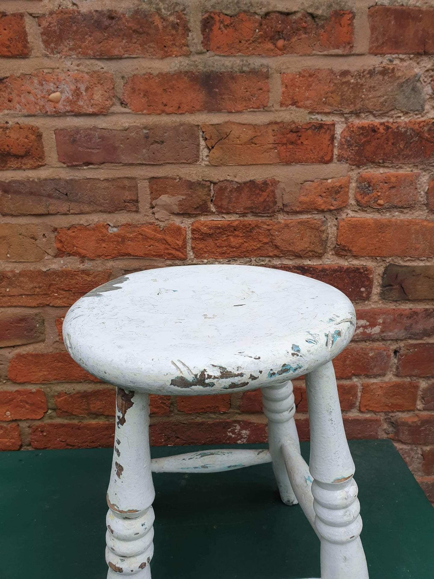 Small round white wooden stool
