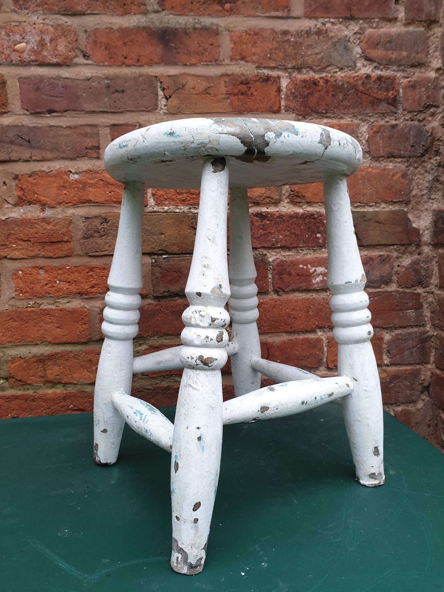 Small round white wooden stool