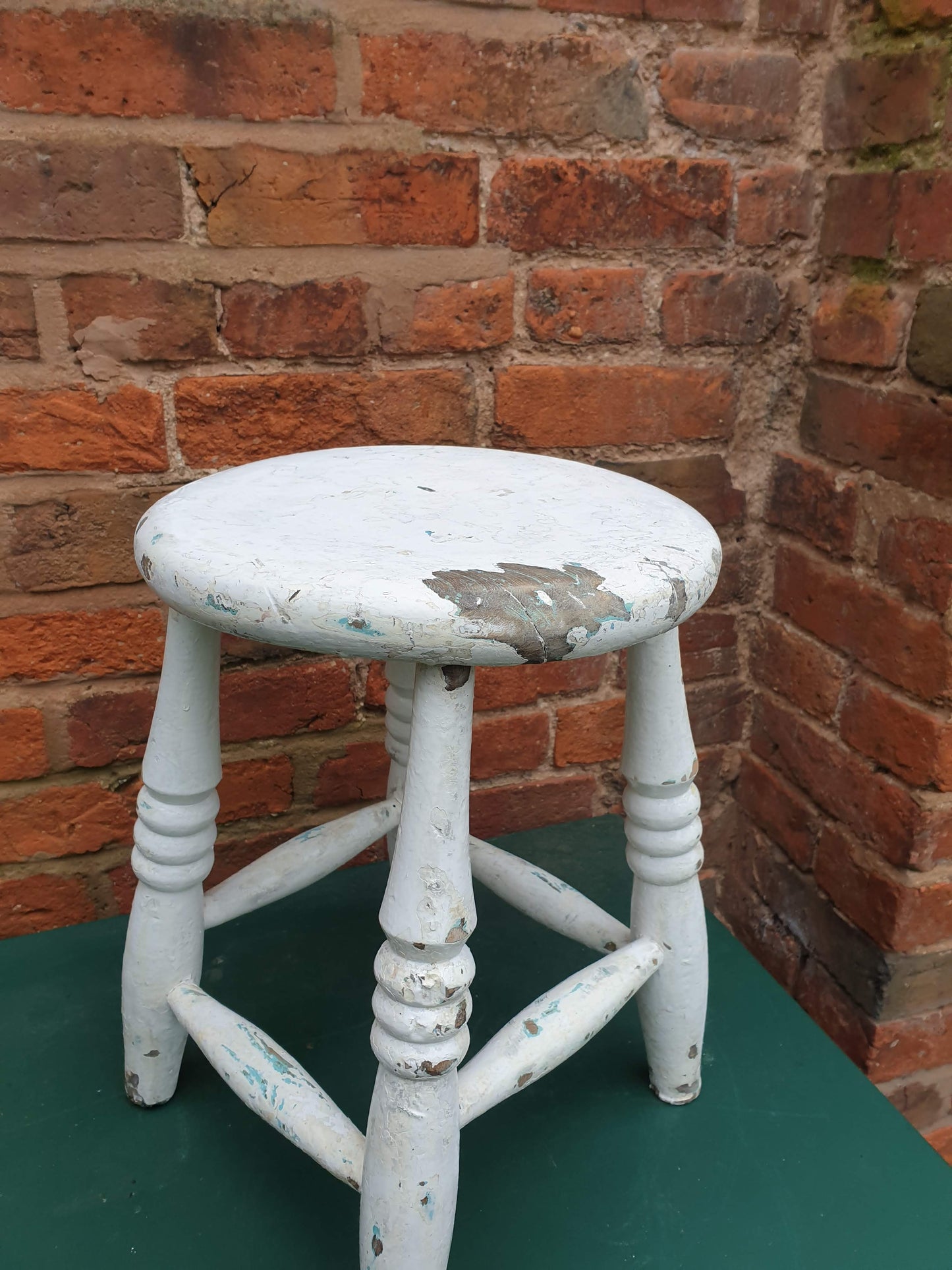 Small round white wooden stool
