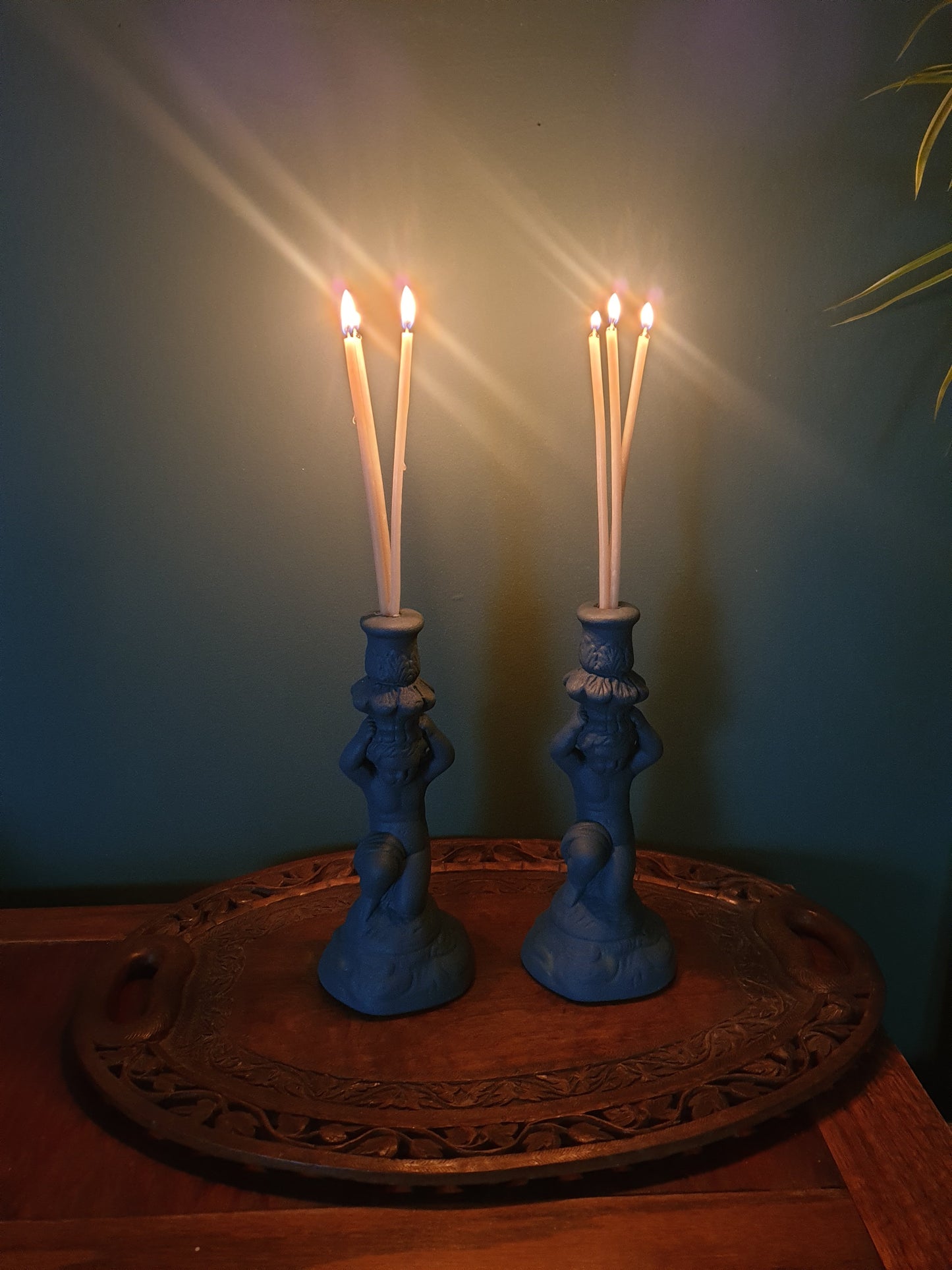 Pair of stone effect cherub candle holders