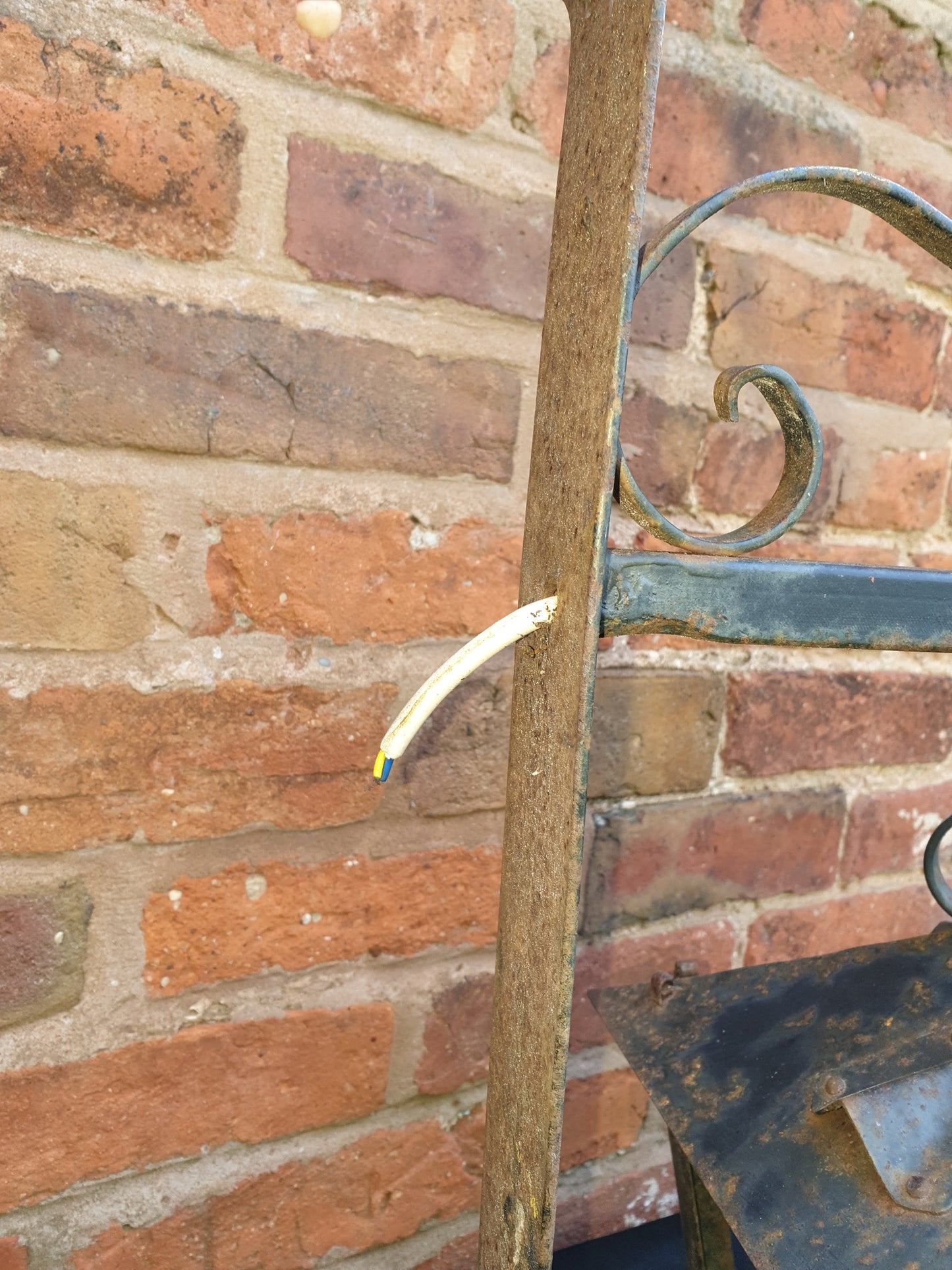 Antique wrought iron coach lamp