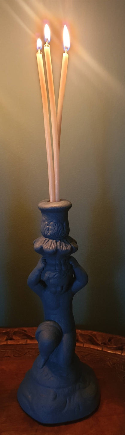 Pair of stone effect cherub candle holders