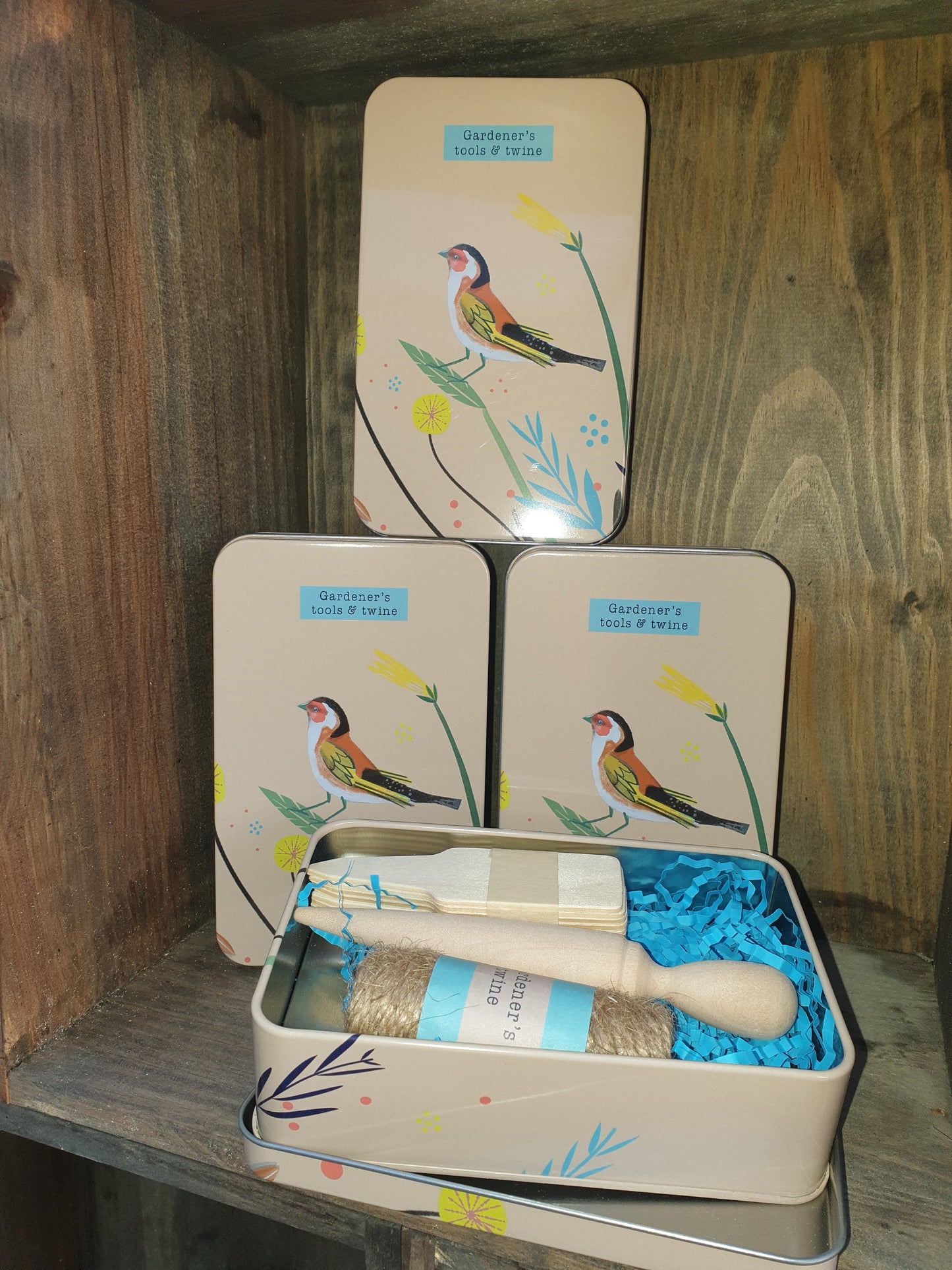 Gardeners tools and twine in a tin